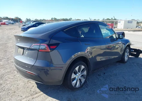2023 Tesla Model Y Awd/Long Range Dual Motor All-Wheel Drive z USA, uszkodzony, nr VIN 7SAYGDEE4PA161053